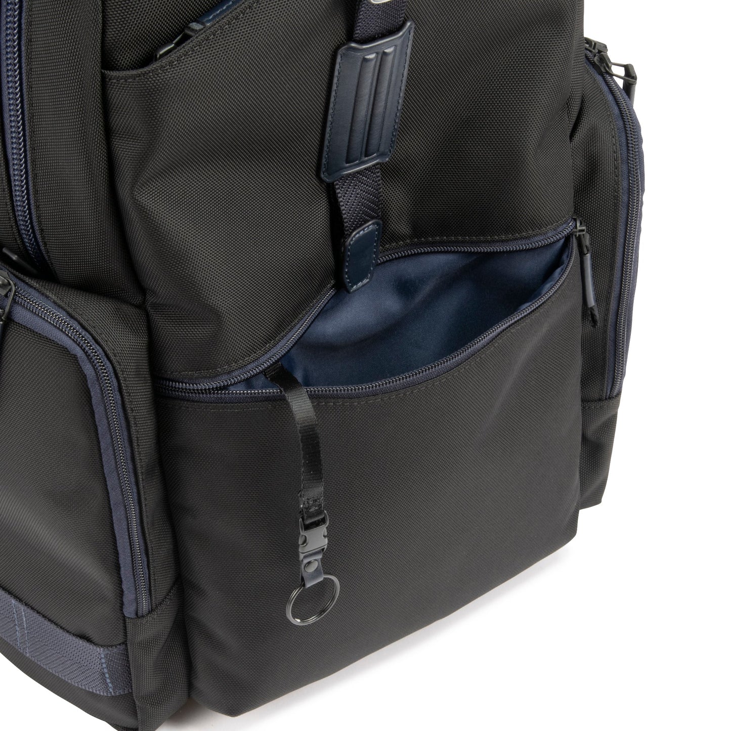 Navy - backpack with multiple compartments and zippers on a white background