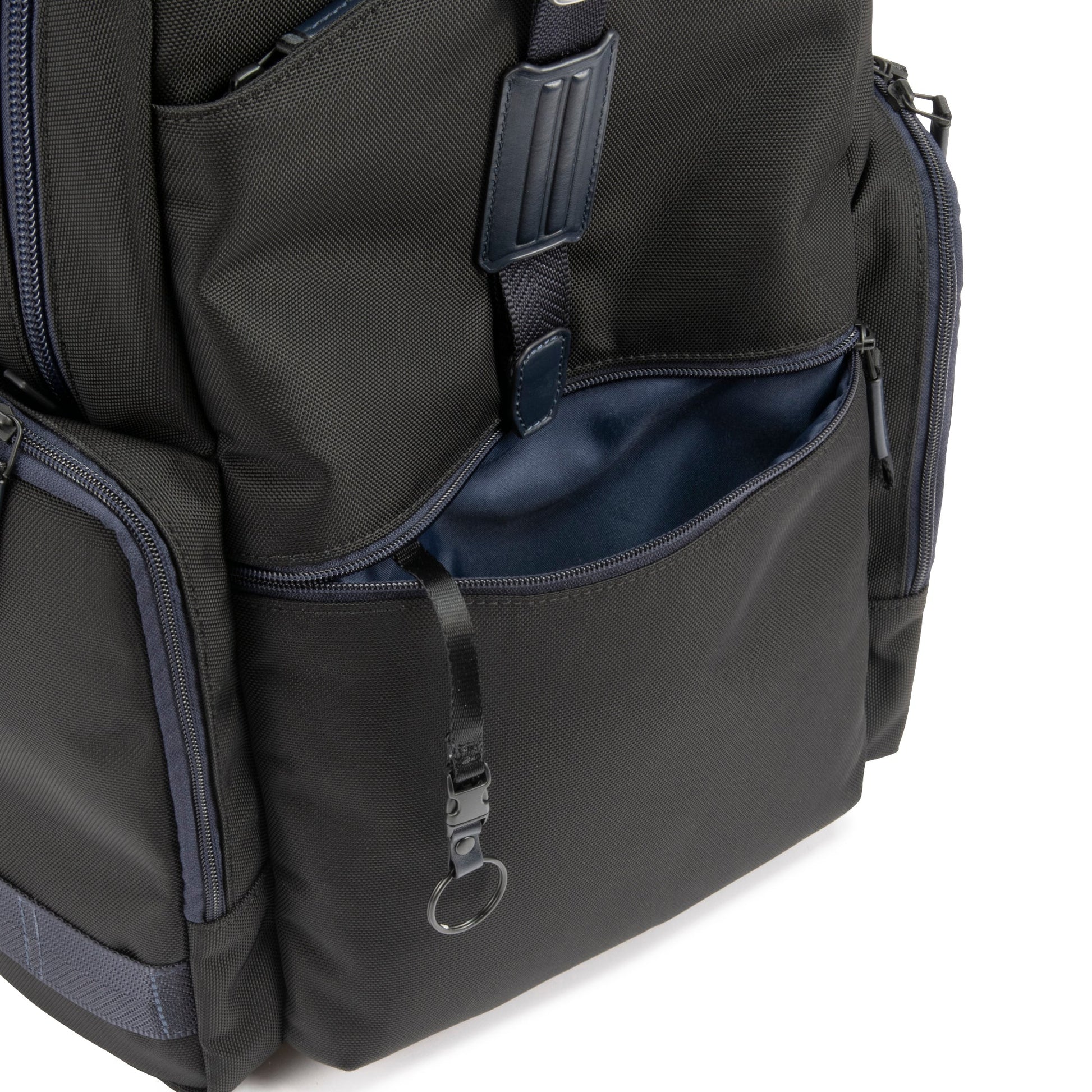 Navy - backpack with multiple compartments and zippers on a white background