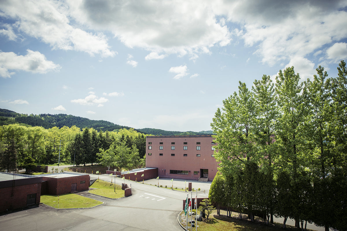 Exterior view of the PROTECA Akabira Factory surrounded by nature in Hokkaido