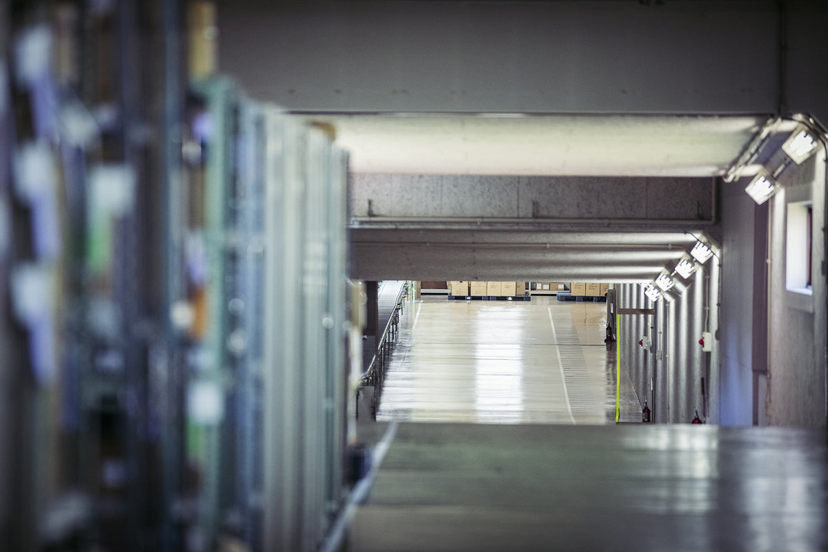 Interior view of factory production line and warehouse corridor for luggage manufacturing